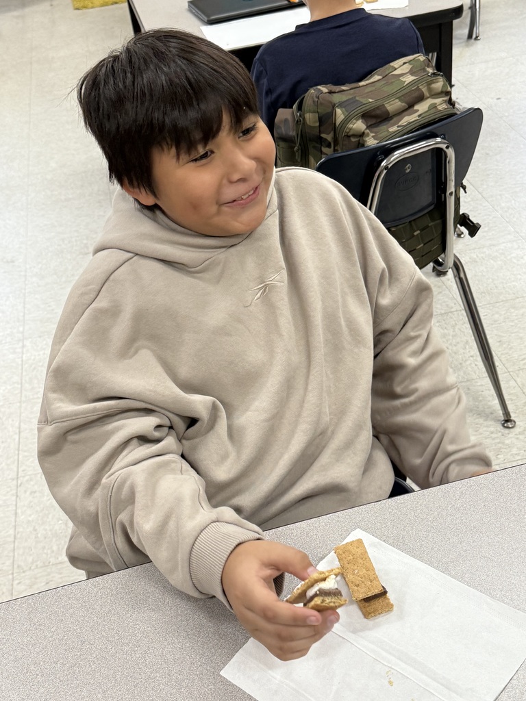 student eating smores