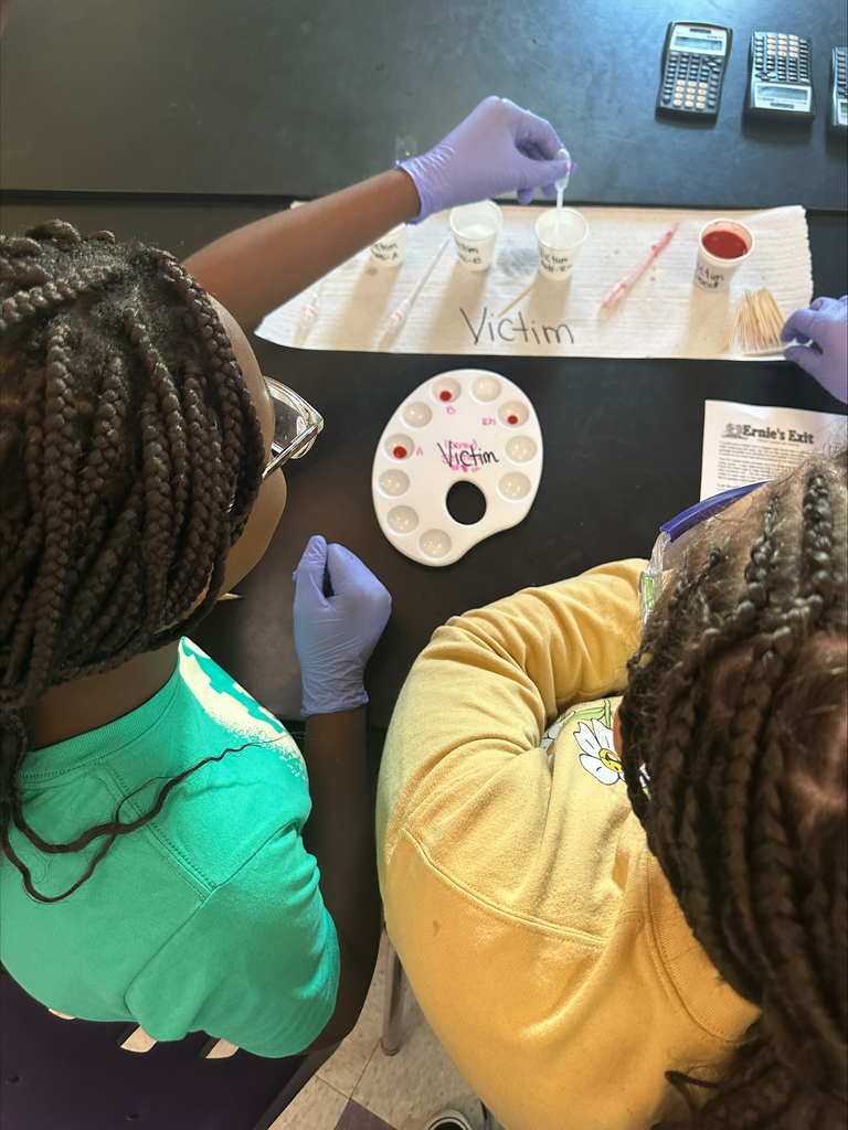 Girls testing blood samples