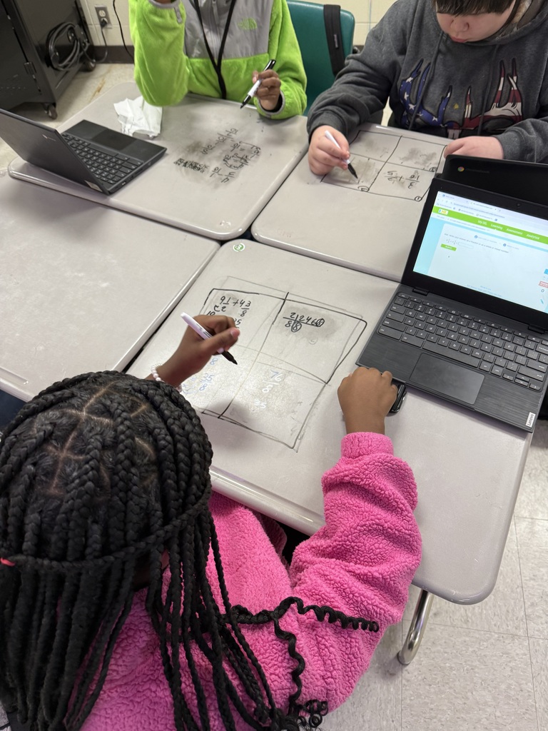 Students working on tables