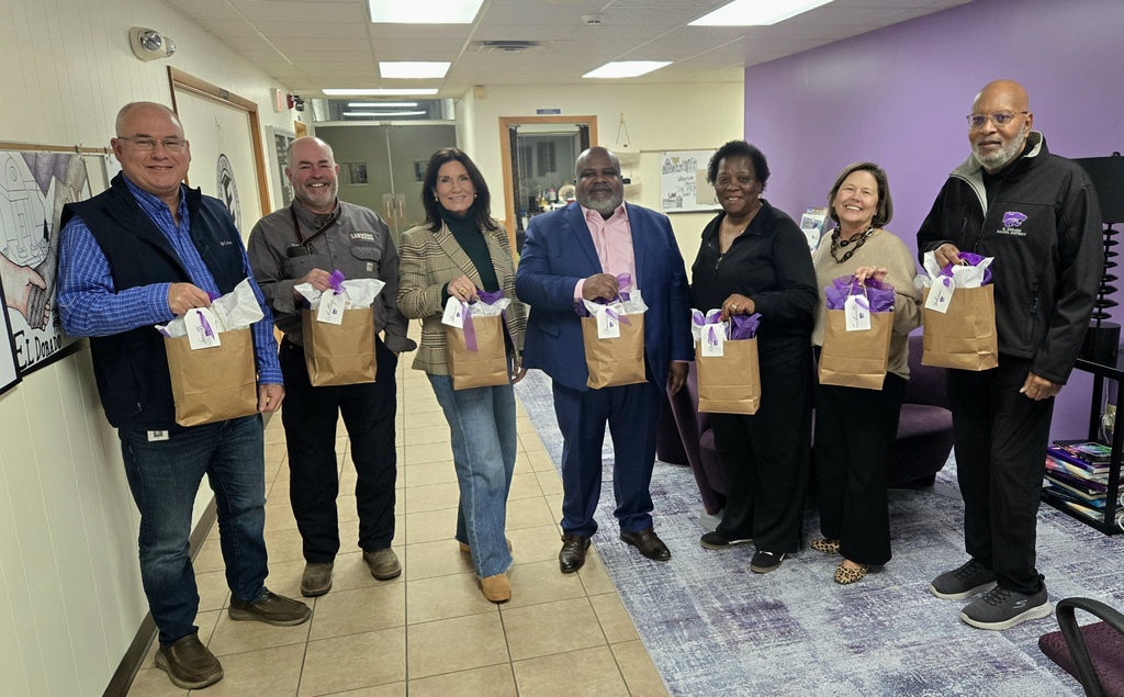 school board members pictured with board recognition gifts