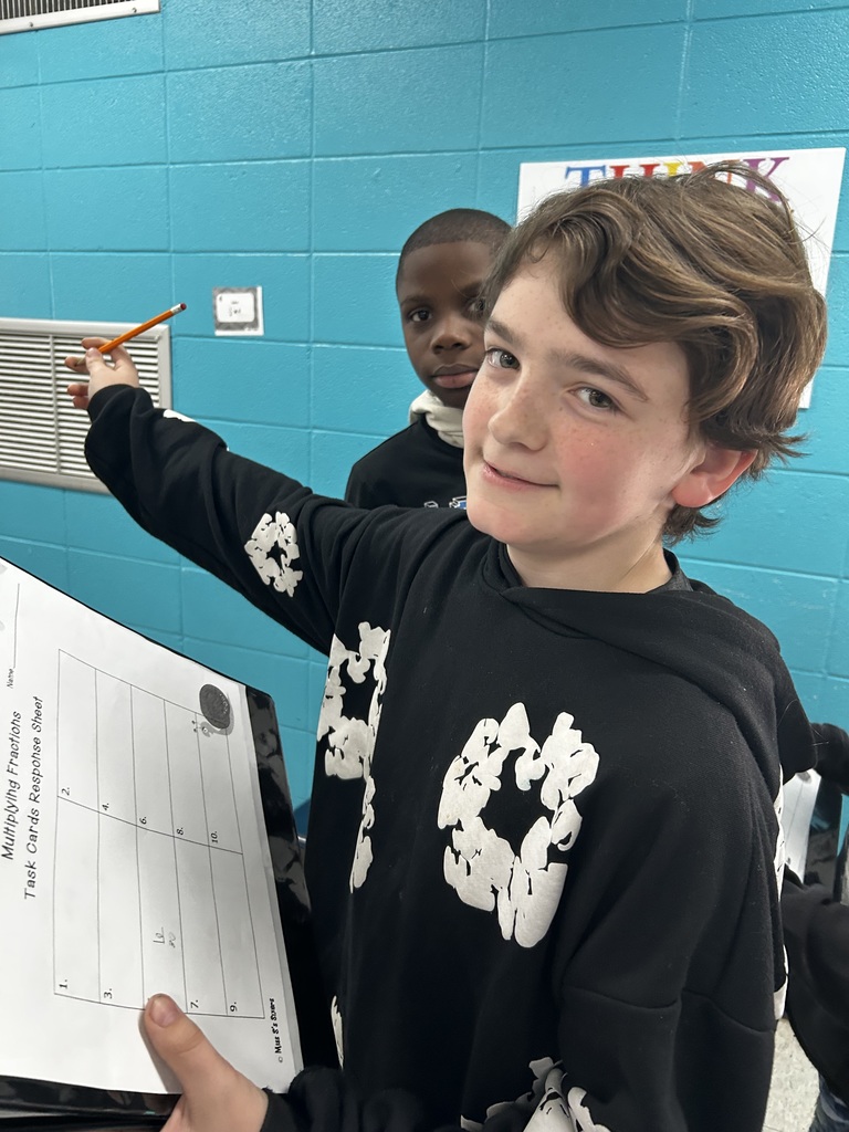 Students multiplying fractions