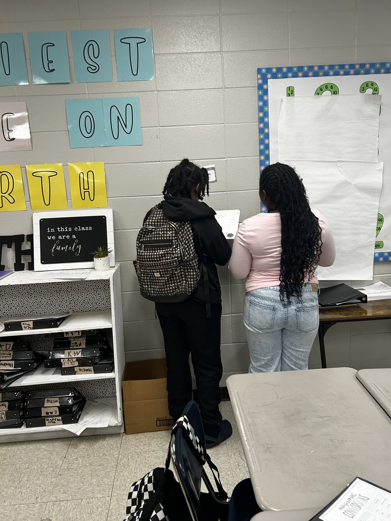 Students multiplying fractions