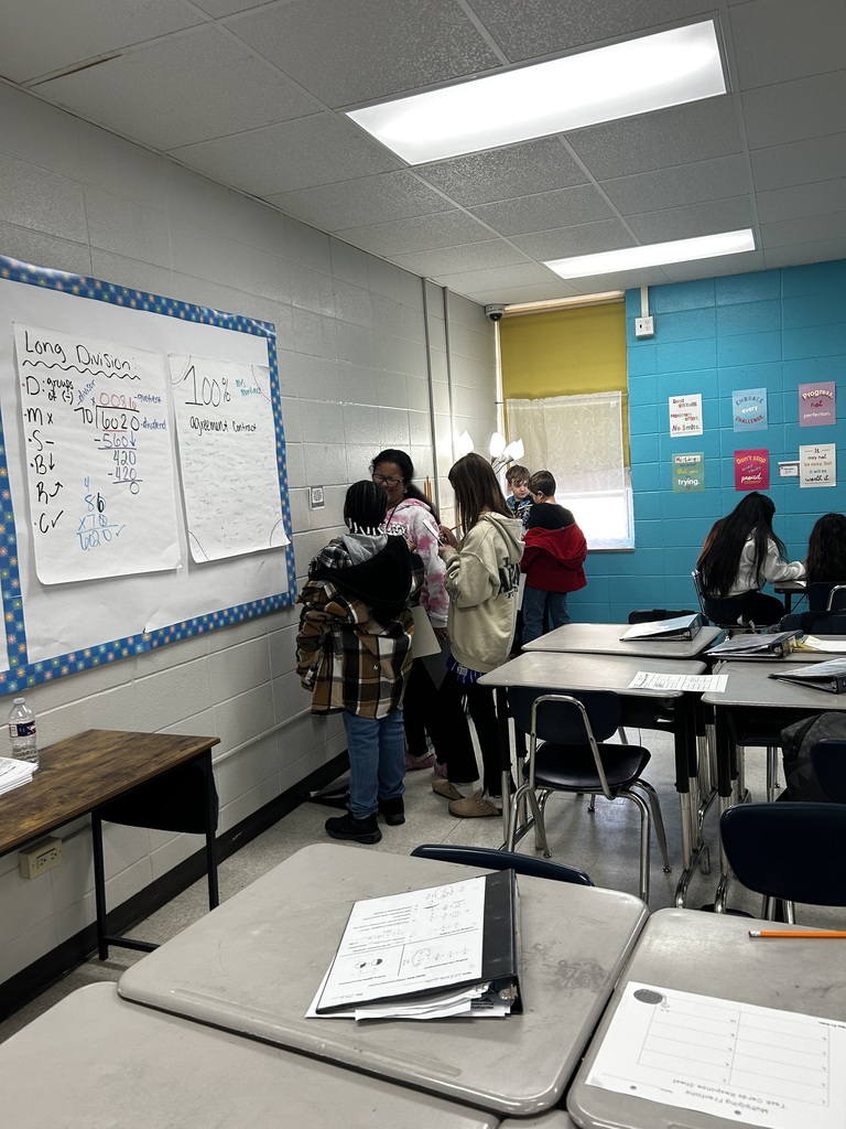 Students multiplying fractions