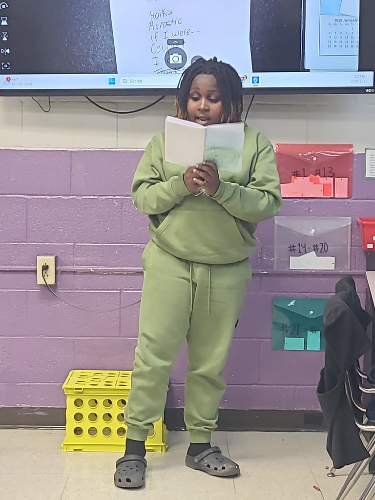 student sharing poetry