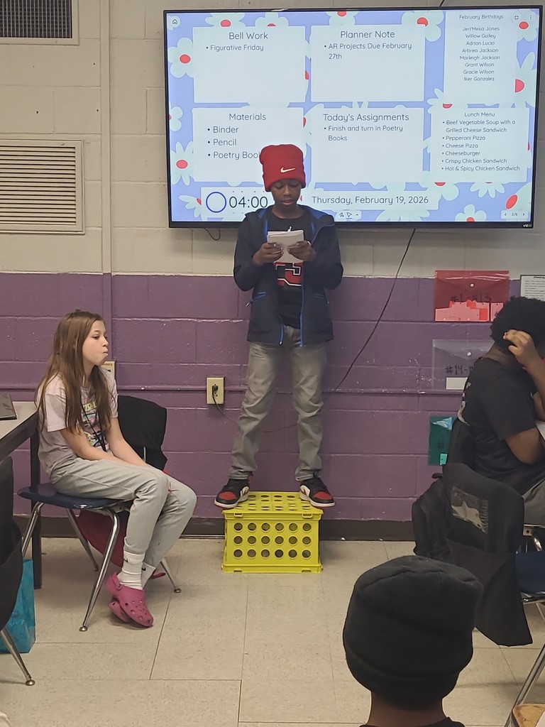 student sharing poetry