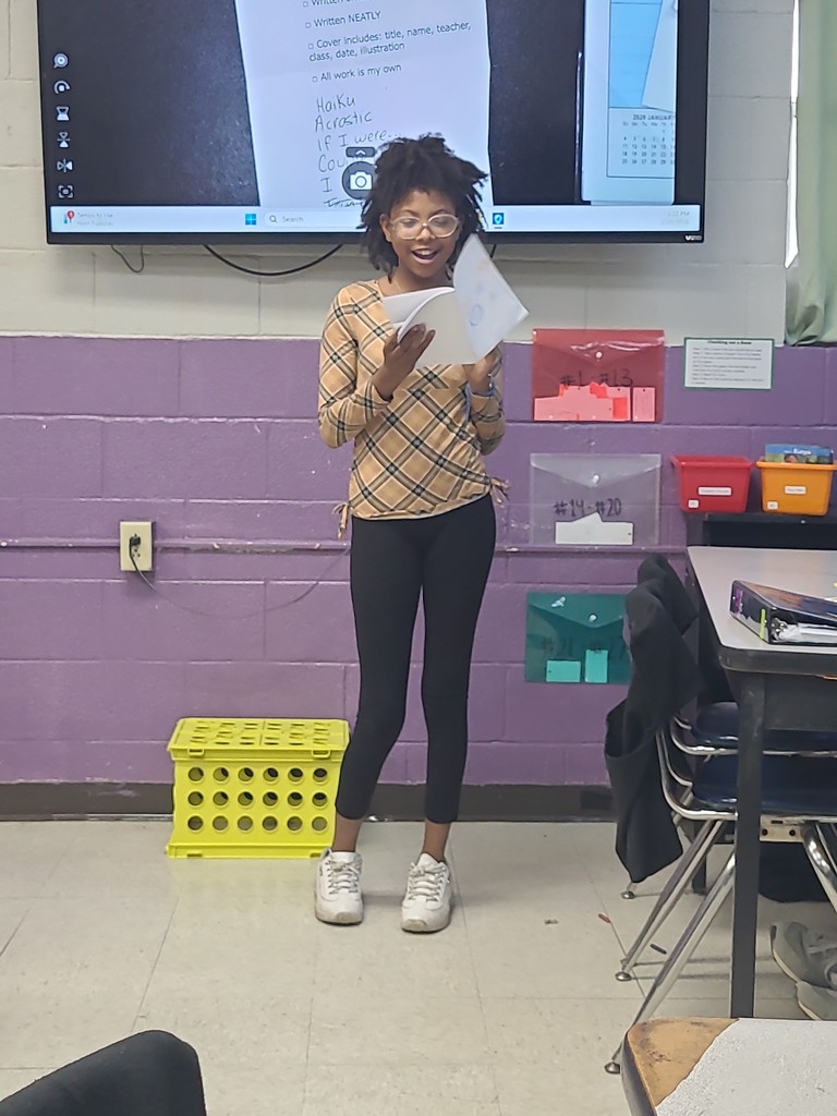 student sharing poetry