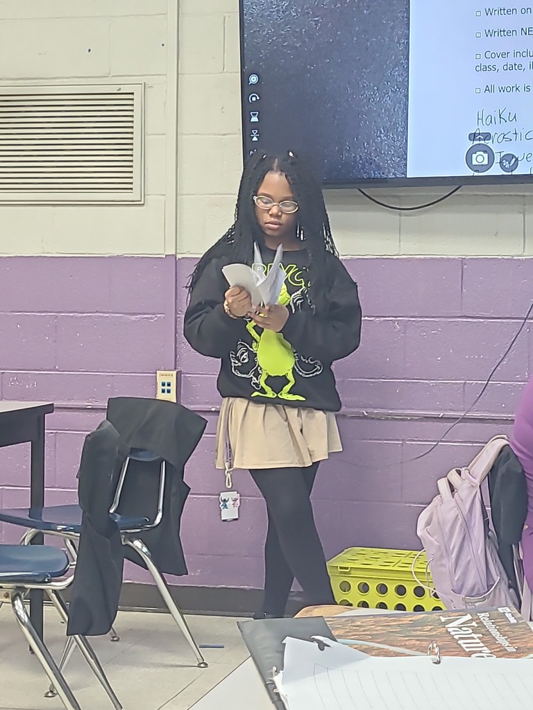 student sharing poetry