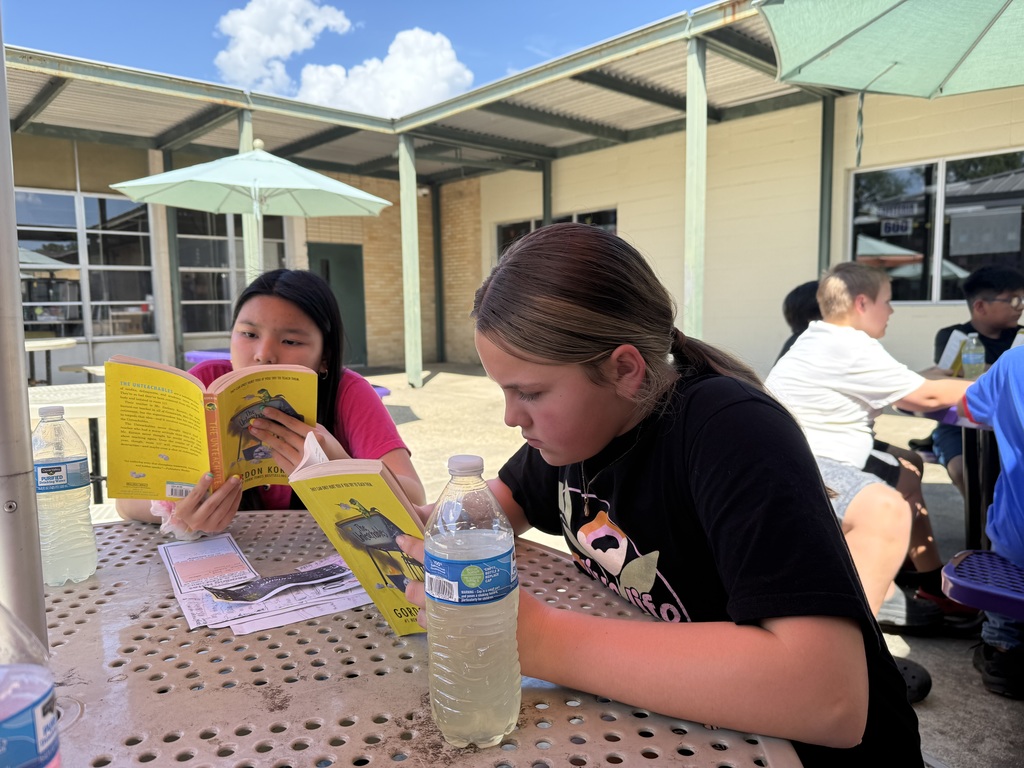 Students reading outside
