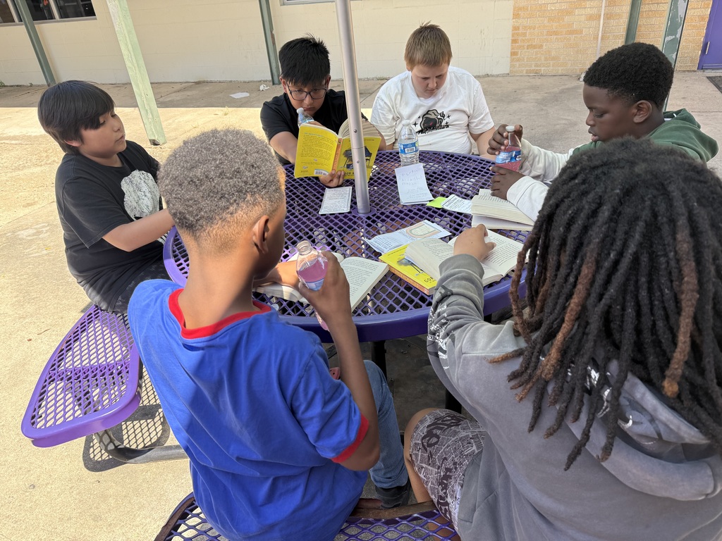 Students reading outside