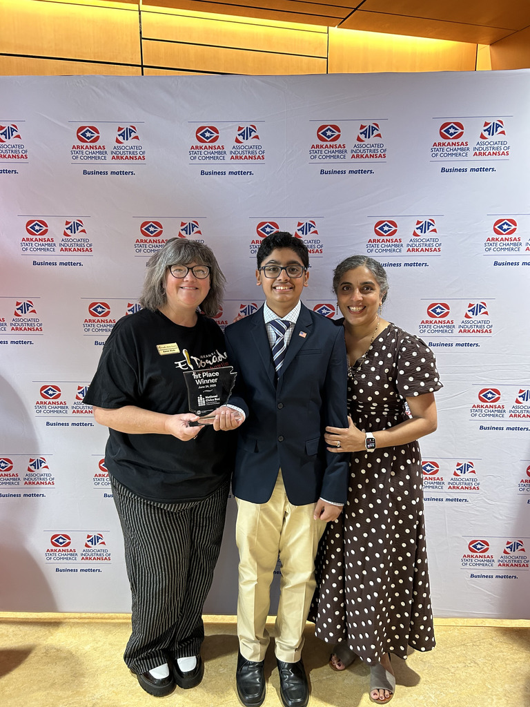 jai pictured with mother and chamber of commerce employee karen hicks holding first place state spelling bee plaque
