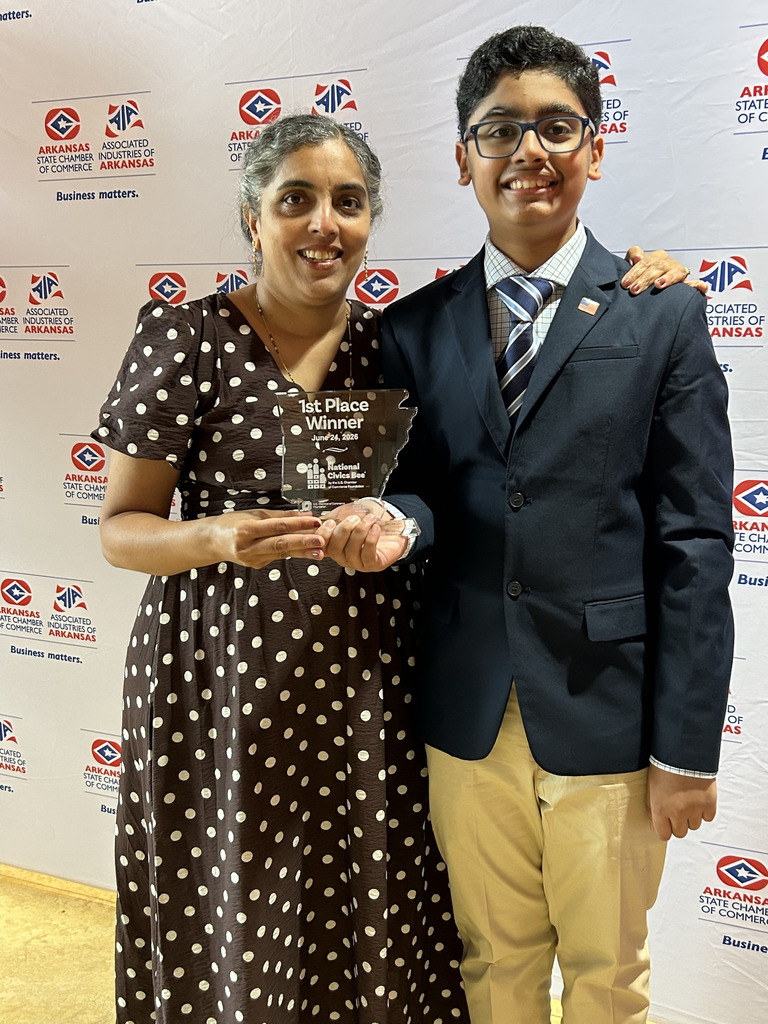 jai pictured with mother holding first place state spelling bee plaque