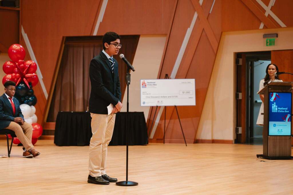 jai speaking into microphone at state civics bee