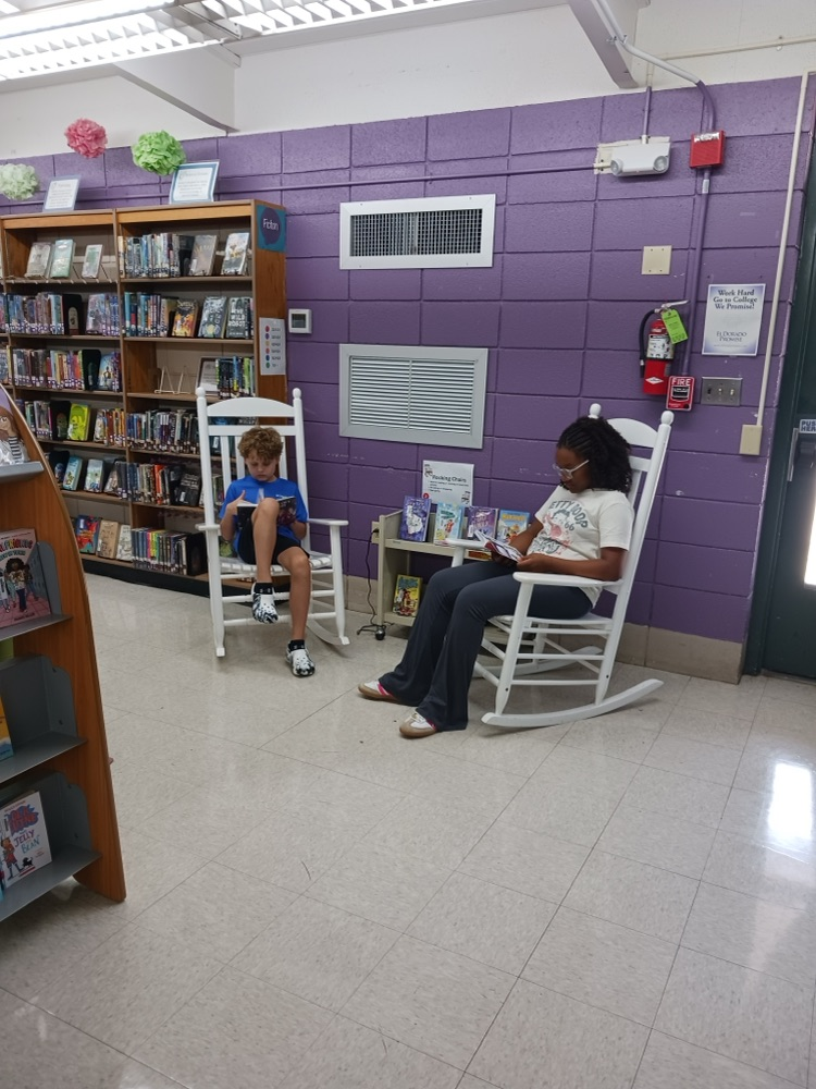 students reading in chairs