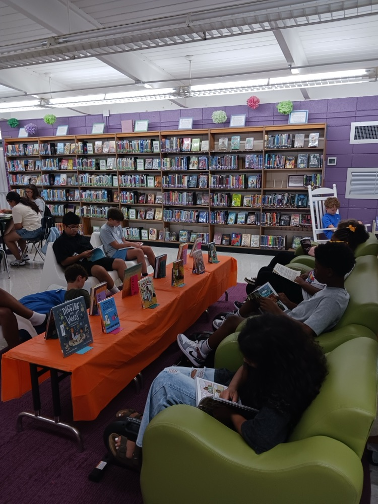 students reading in the library 