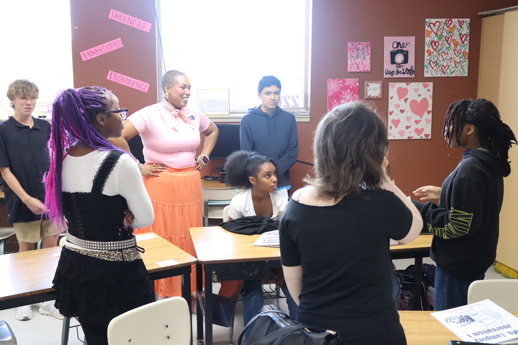 students and teacher working in group project