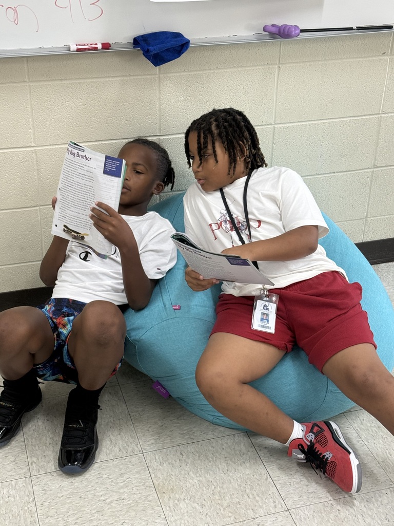 Students reading in different places in the classroom