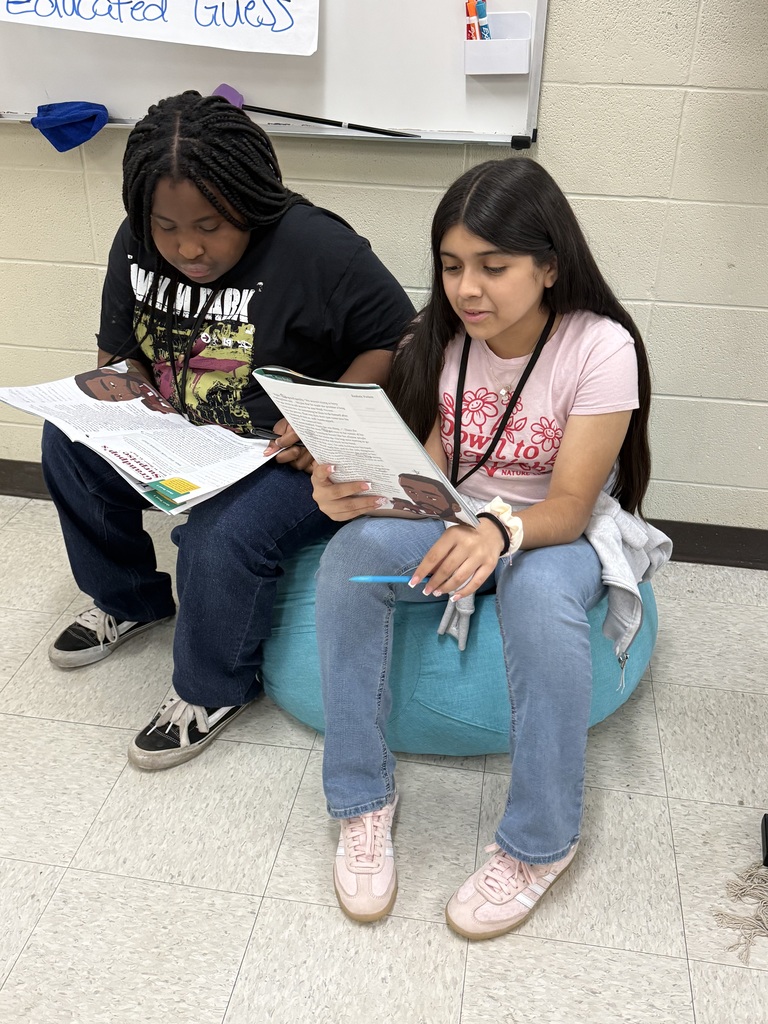 Students reading in different places in the classroom