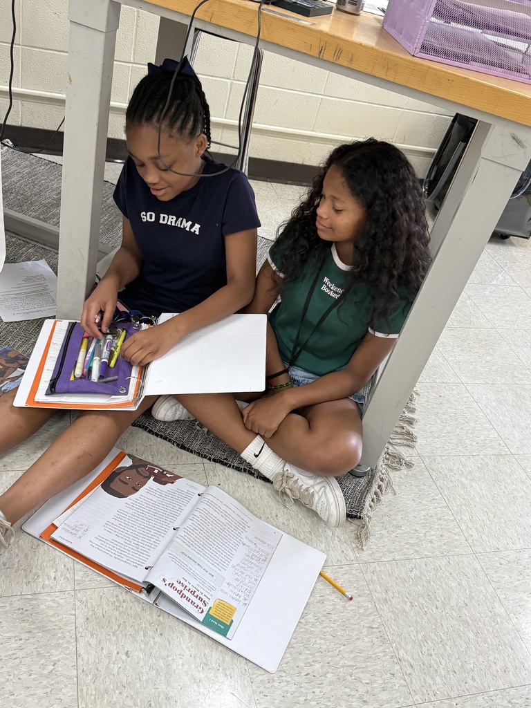 Students reading in different places in the classroom