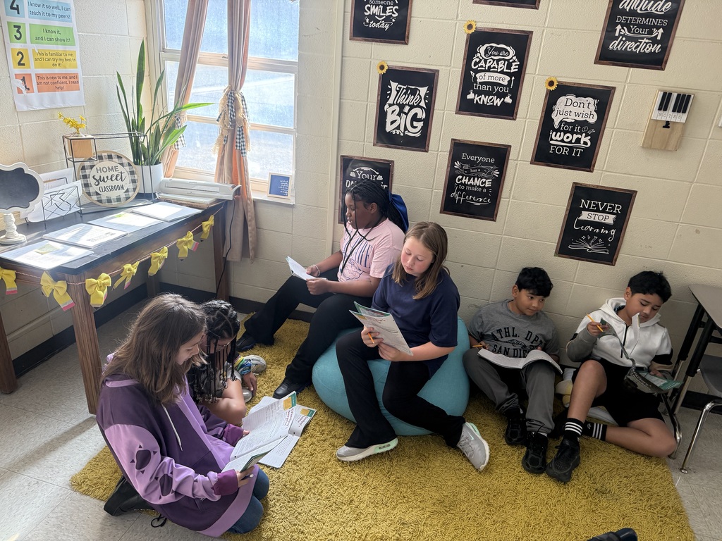 Students reading in different places in the classroom