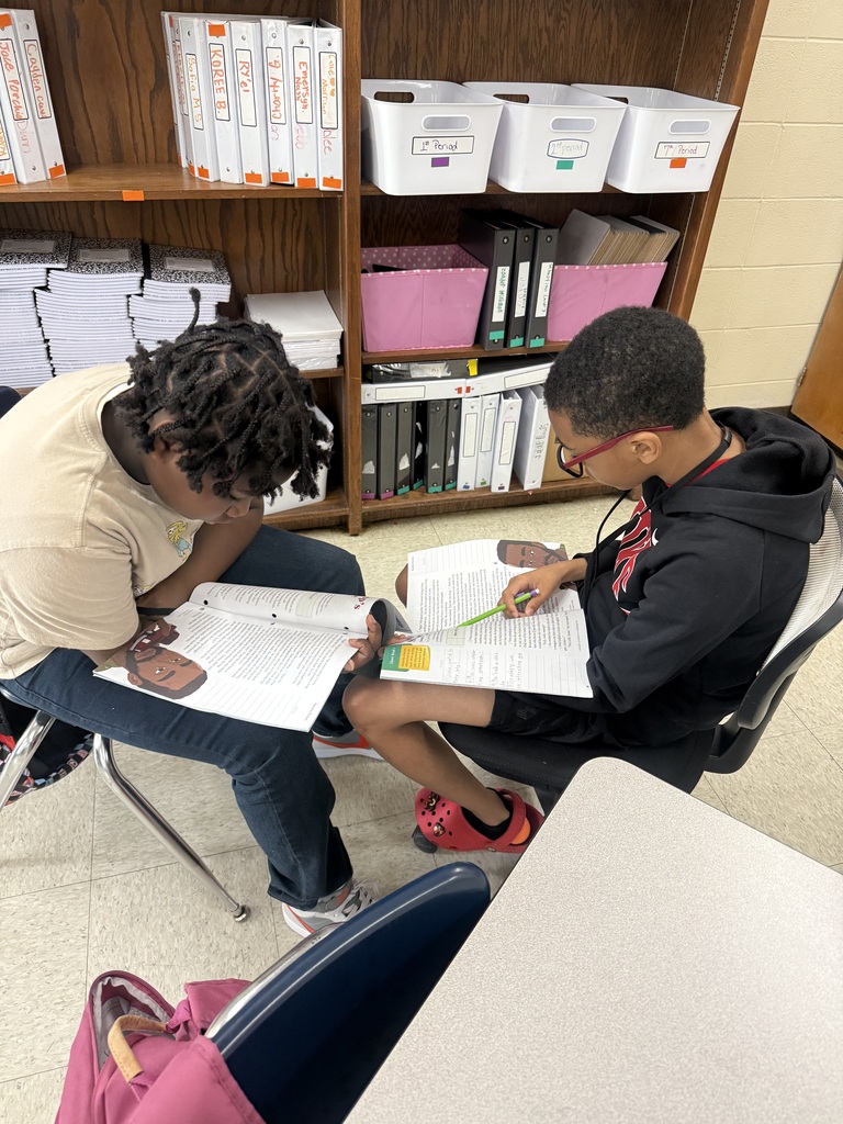 Students reading in different places in the classroom