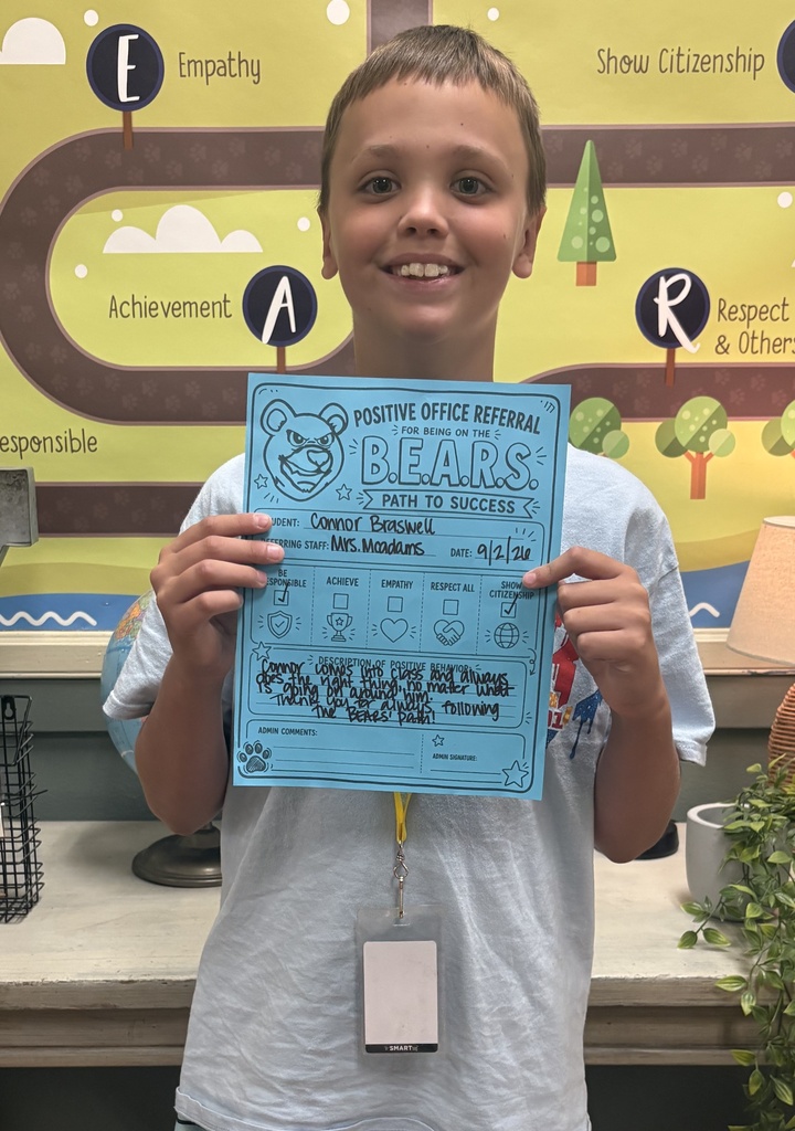 connor braswell standiing with a positive office referral