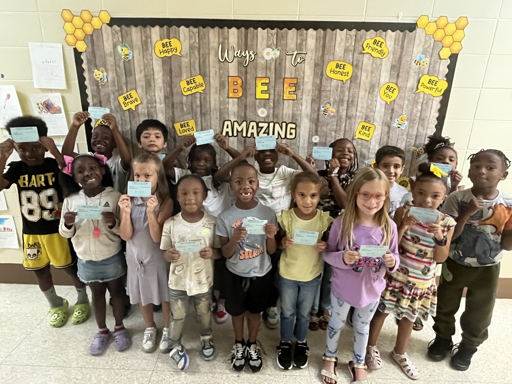 students standing in a group showing off their fair passes
