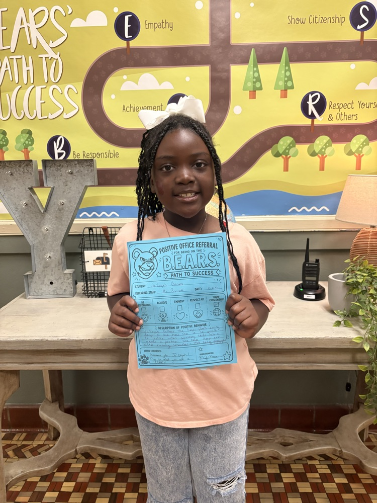 student holding a paper