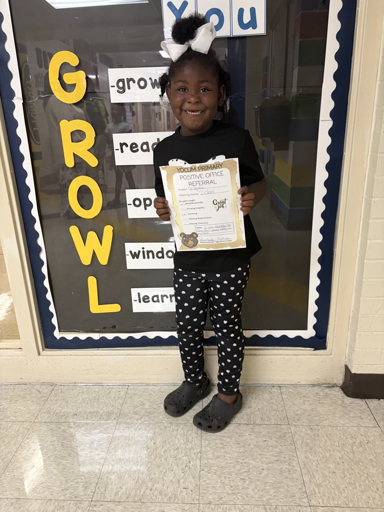 student holding a paper
