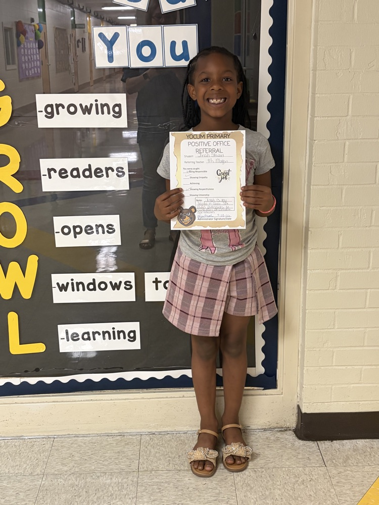 student holding a paper