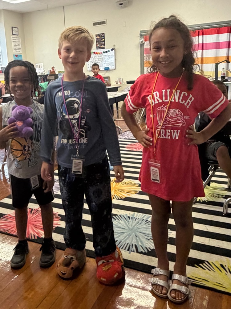 kids standing in the middle of the classroom