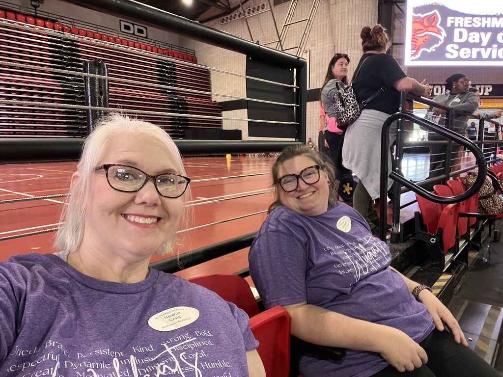 Two El Dorado School District educators smile for a selfie from the arena seating during Special Olympics Arkansas RecFest.