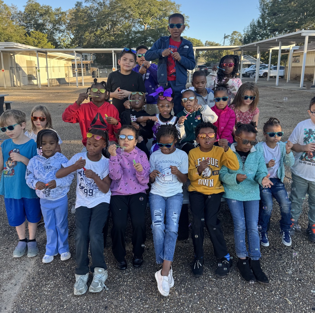 students in a group blowing bubbles
