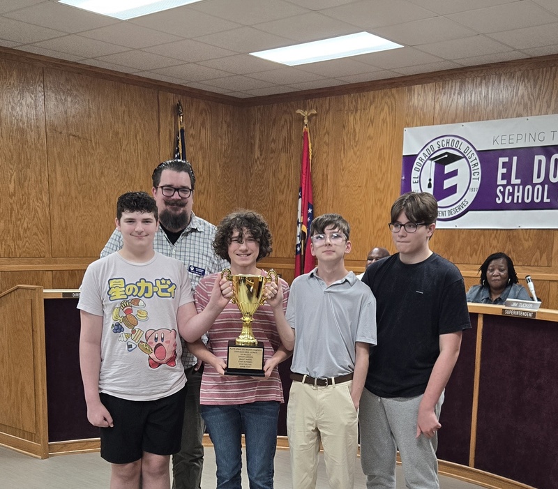 barton esports team holding trophy at october board meeting