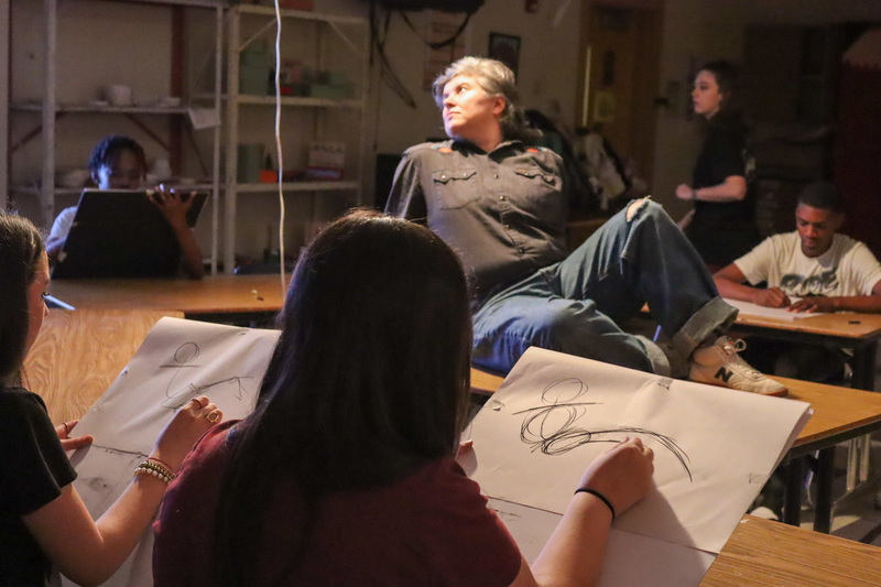 student drawing live model