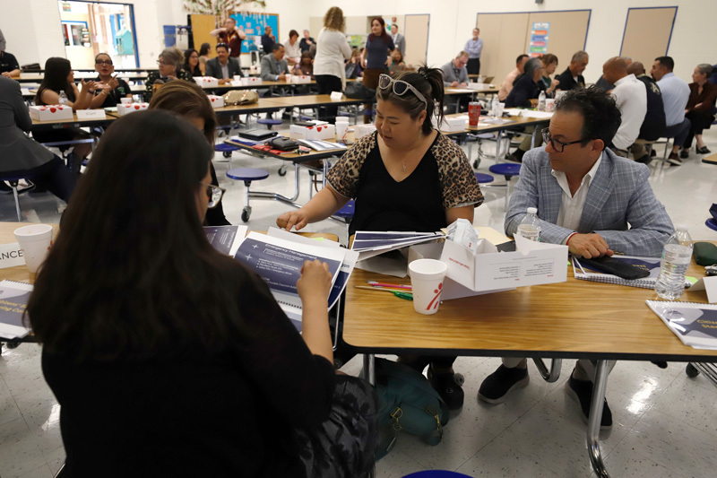 Community members discuss a presentation
