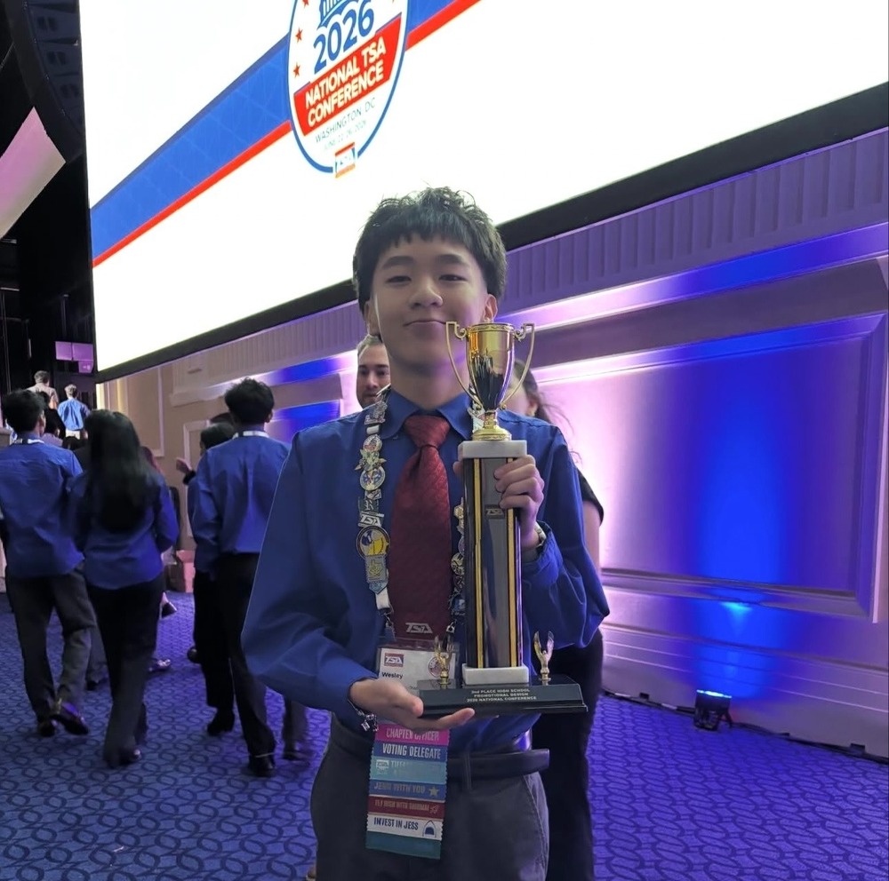 Chapin High School sophomore Wesley Vo smiles with trophy at the Technology Student Association (TSA) National Conference in Washington, D.C., earning second place in the nation in Promotional Design.