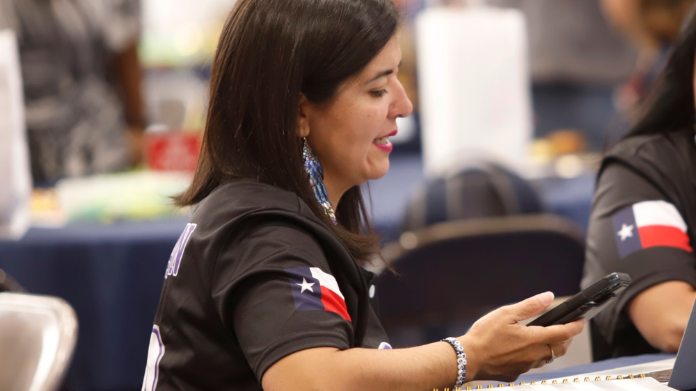 Staff member uses new app on cell phone