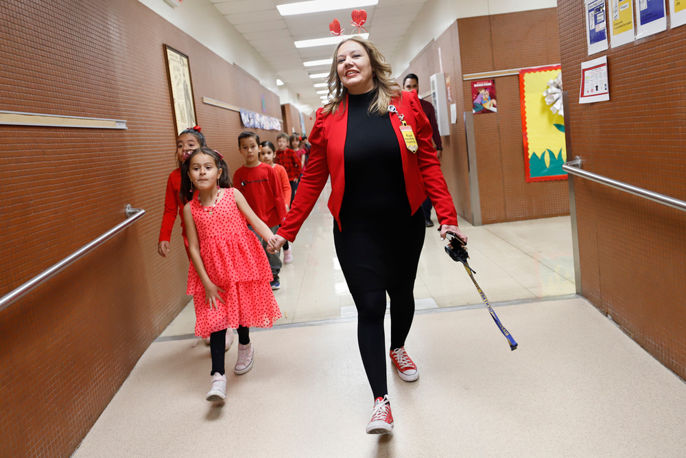 Counselor walking the halls with a student