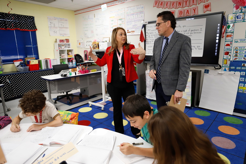 Superintendent Lusk speaks with a teacher