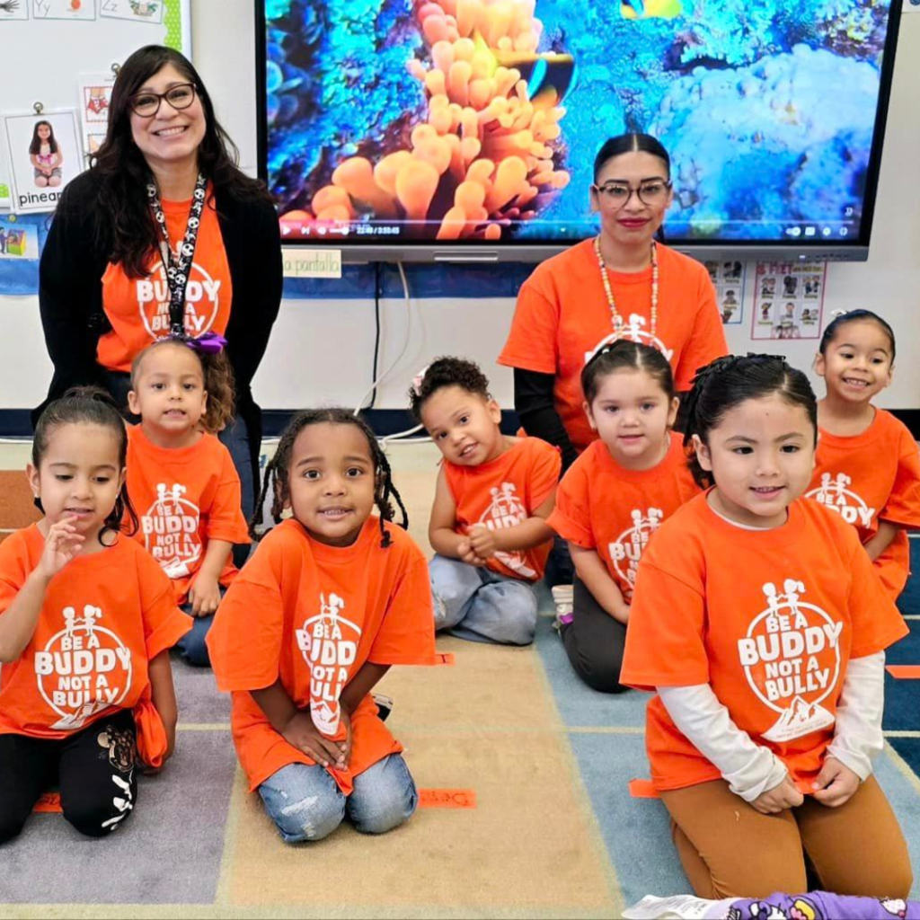 Whitaker Elementary students taking photo in Be a Buddy Not a Bully t-shirts