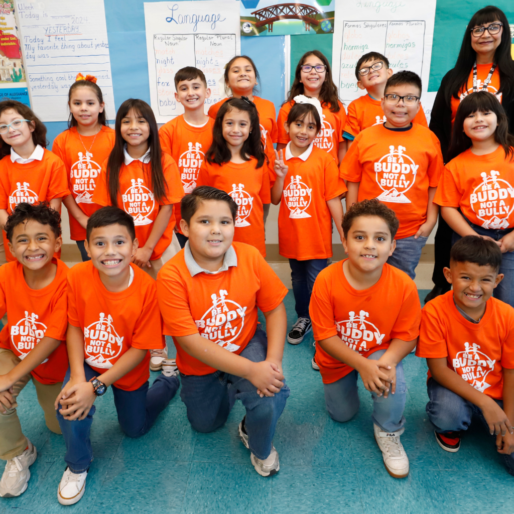 Moreno Elementary students taking photo in Be a Buddy Not a Bully t-shirts