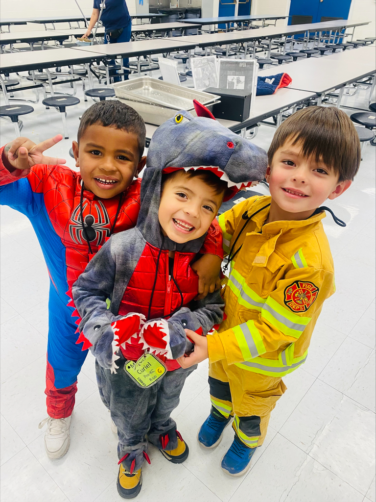 Mesita ECDC students dressed as spiderman, a dragon, and firefighter