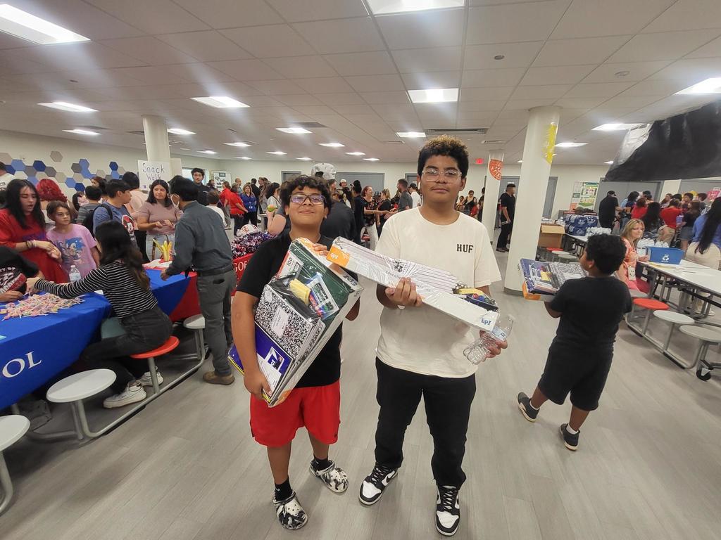 Irvin students smile for a photo with new school supplies at the 2024 Back to School Fiesta