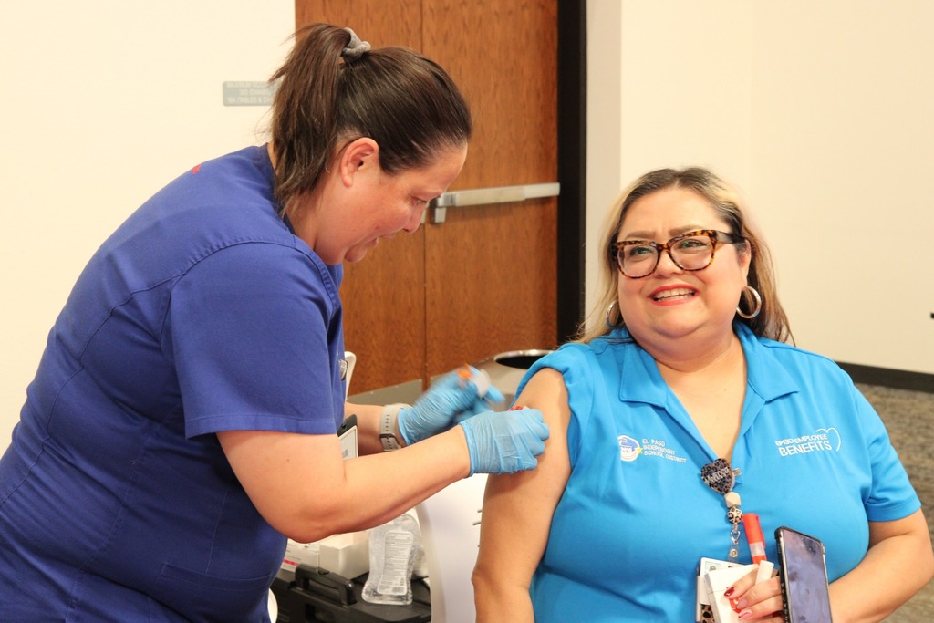 Employee receiving a vaccine