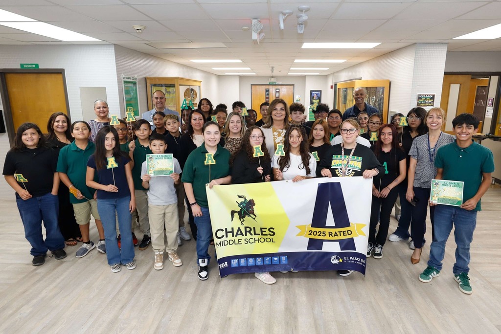 Charles Middle School students, staff, Interim Superintendent Martha Aguirre, and EPISD leadership take photo with the school's A-rated campus banner