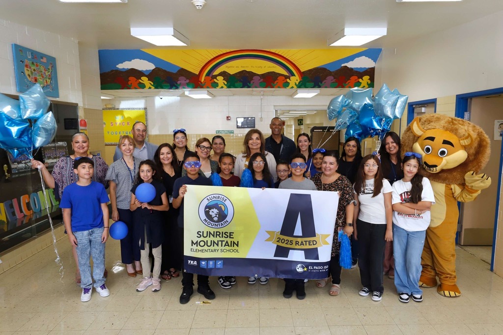 Sunrise Elementary School students, staff, Interim Superintendent Martha Aguirre, and EPISD leadership take photo with the school's A-rated campus banner