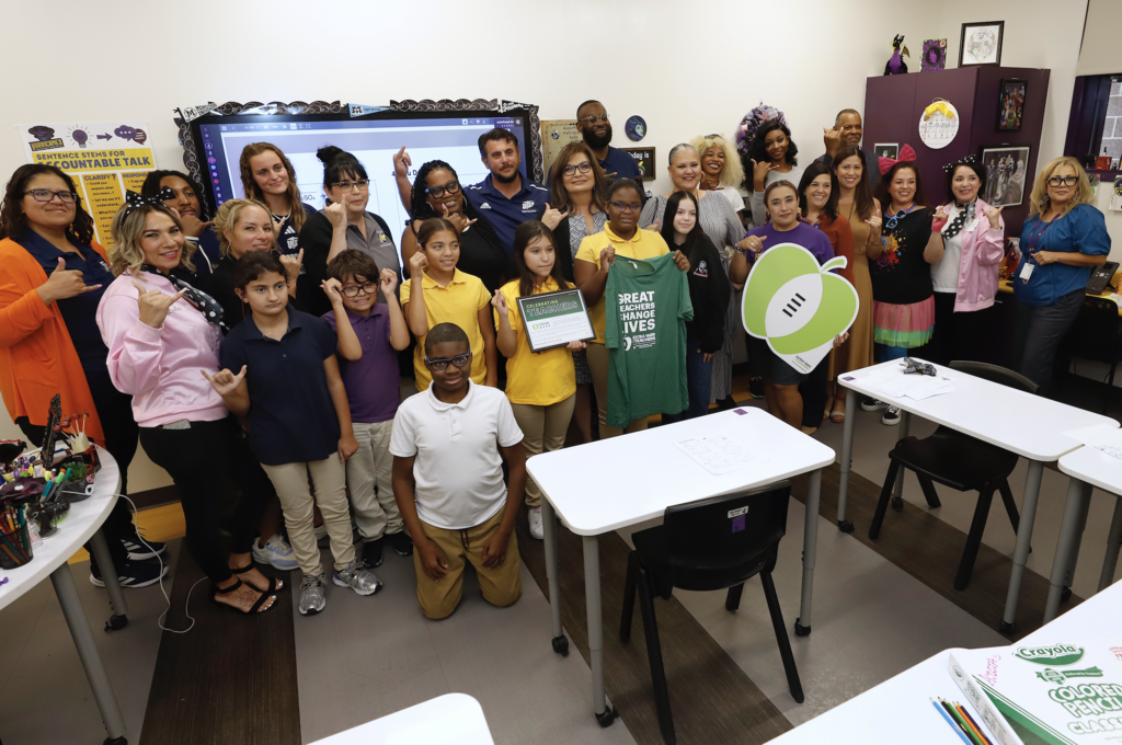 Group photo of Hartley PK-8 School students and staff, El Paso ISD leadership, and Interim Superintendent Martha Aguirre, and  representatives from UTEP Athletics