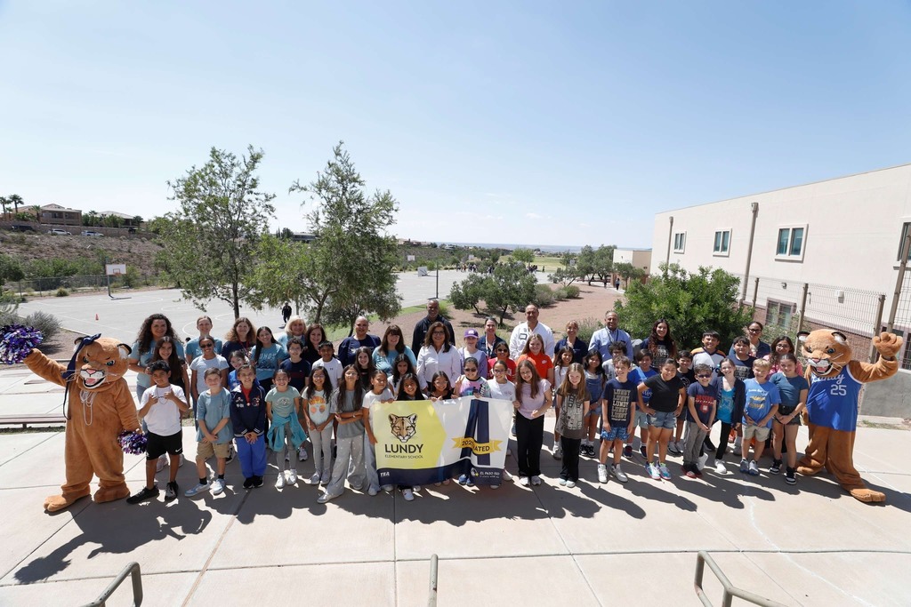 Lundy Elementary School takes group photo with a-rated campus banner