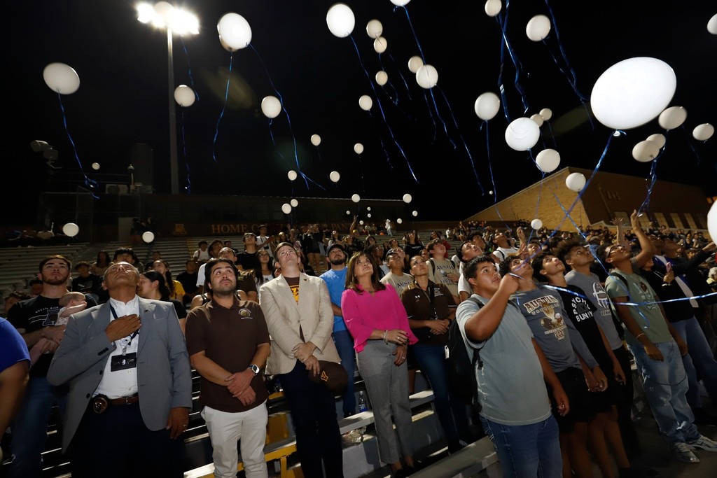 Students, faculty, and Austin community members release balloons