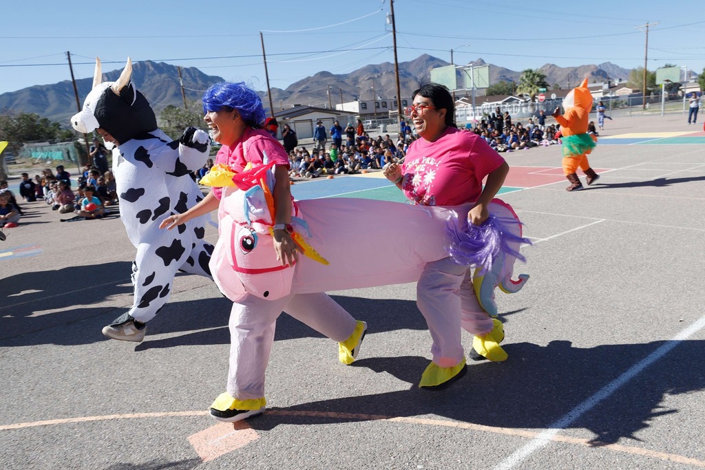 2nd annual teacher inflatable costume race. Unicorn and cow racing